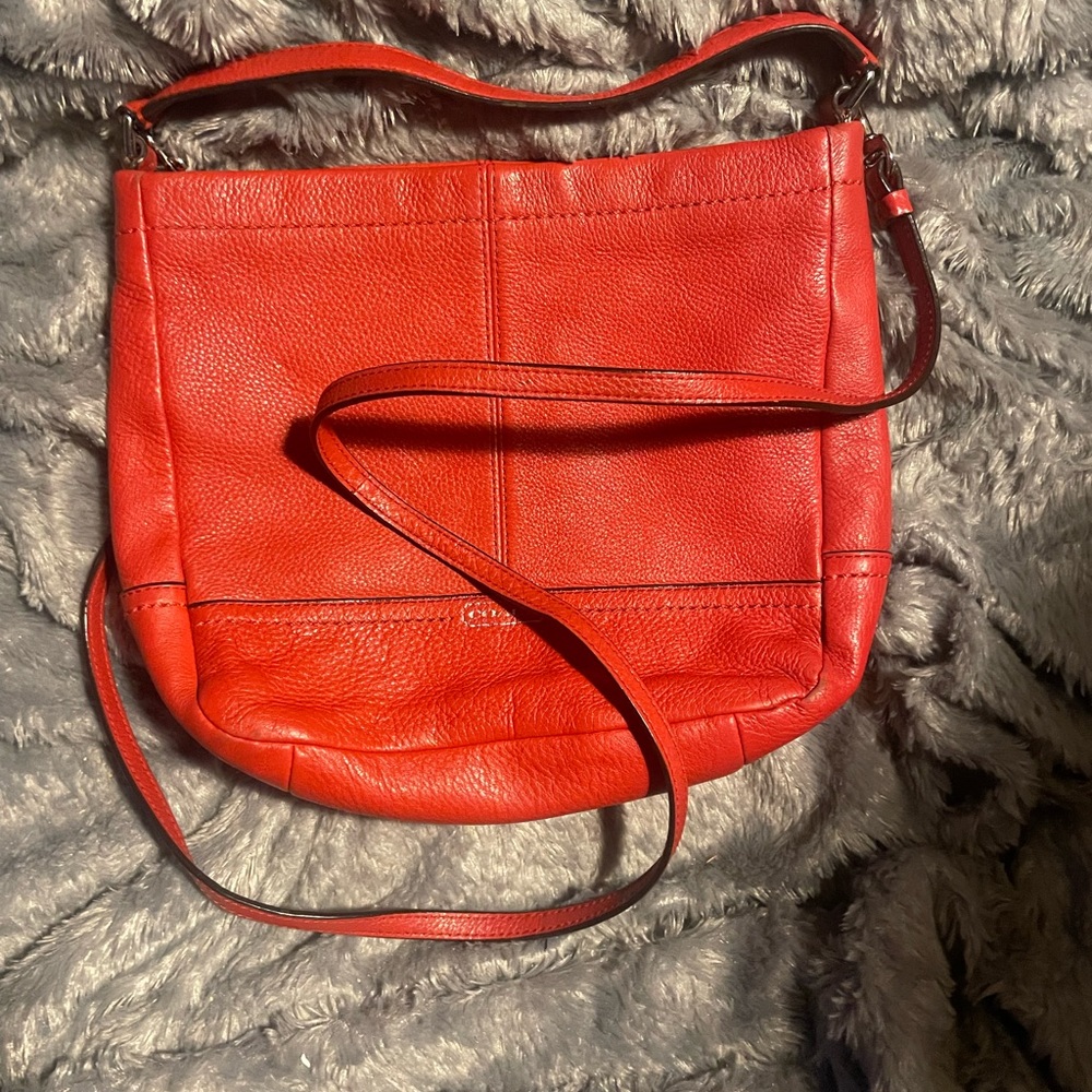 Red Coach Small -> Medium Satchel.